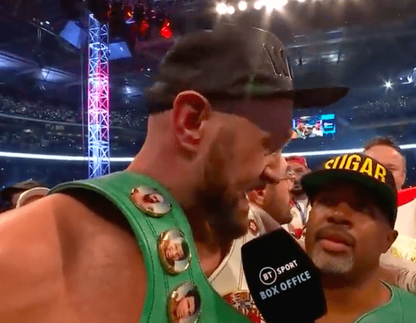 Tyson Fury after beating Dillian Whyte in the ring with trainer Sugar Hill Steward