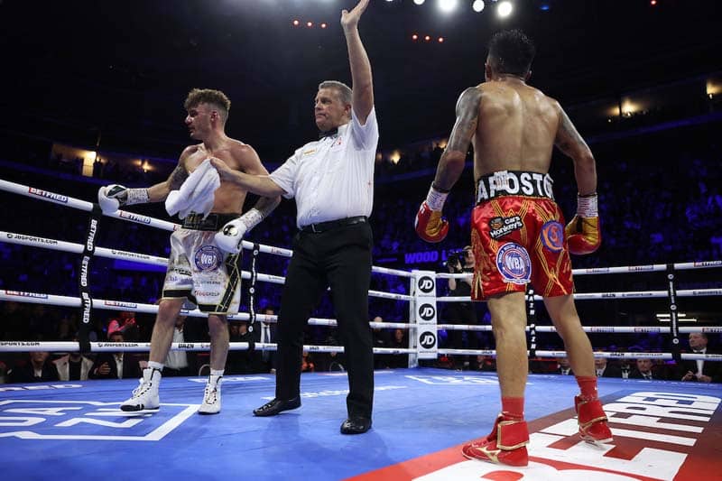 Leigh Wood's trainer Ben Davison tosses the towel into referee Michael Alexander's hands to end the fight. Photo Mark Robinson, Matchroom Boxing Wood vs Lara results