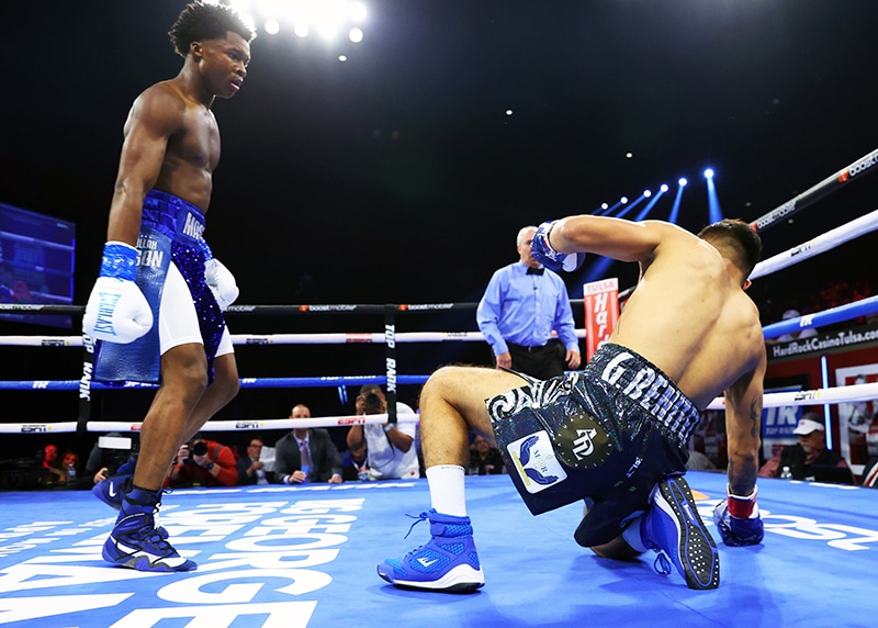 Abdullah Mason knocks-down Erick Garcia Benitez during their lightweight fight at Hard Rock Hotel & Casino Tulsa on April 1, 2023 in Catoosa, Oklahoma. Photo: Mikey Williams, Top Rank Inc via Getty Images