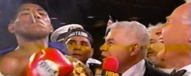 Larry Merchant howls as Ricardo Mayorga smokes in center ring, post-win