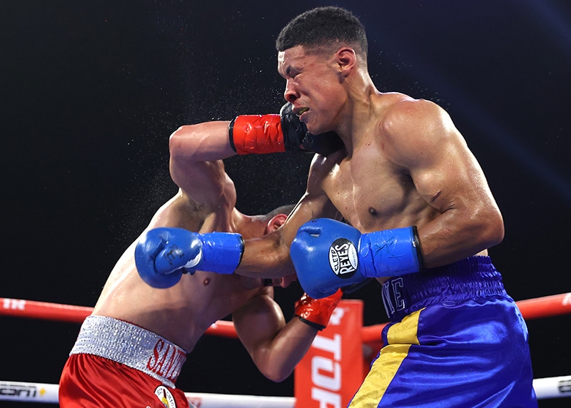 Giovani Santillan lands the right hand against Erick Bone, his best weapon on Saturday in Shawnee, Oklahoma. Photo: Mikey Williams/Top Rank Inc via Getty Images