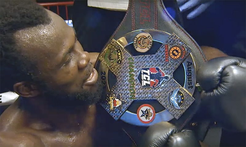 Javonn Davis of the New York Attitude shows off the team championship belt. Photo: Team Combat League