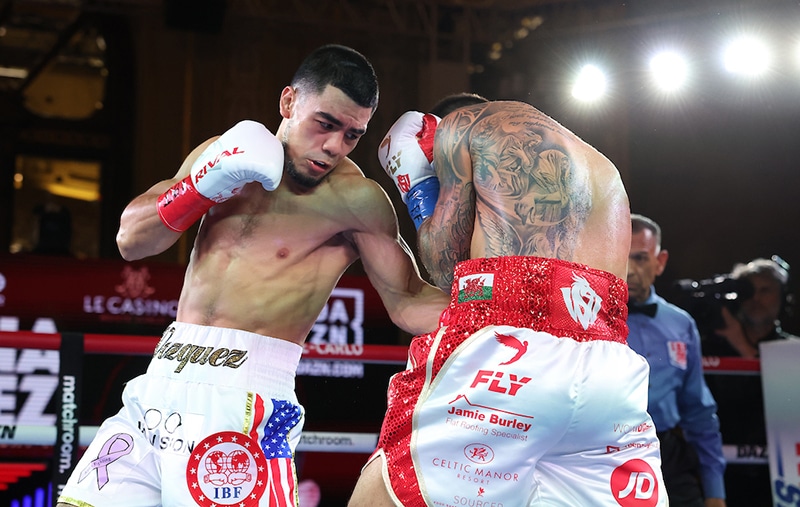 Edward Vazquez lands the left hook to the body of Joe Cordina. Photo: Mark Robinson, Matchroom Boxing