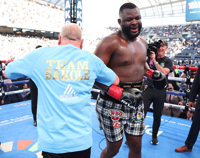 Martin Bakole danced a victory jig in the ring with his team. Photo: Mark Robinson, Matchroom Boxing