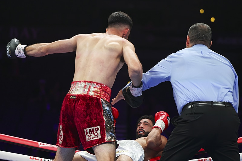 Joel Iriarte came close to driving Miguel Ortiz right through the ropes. Photo: Cris Esqueda, Golden Boy Boxing