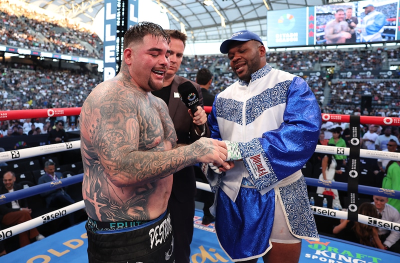 Andy Ruiz Jr shows his injured hand to Jarrell Miller after their fight. Photo: Mark Robinson, Matchroom Boxing