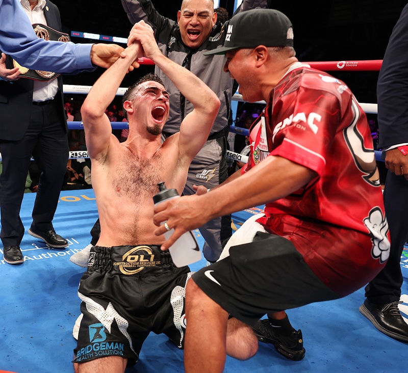 Jose Valenzuela and Robert Garcia celebrate his upset win over Issac Cruz. Photo: Mark Robinson, Matchroom Boxing