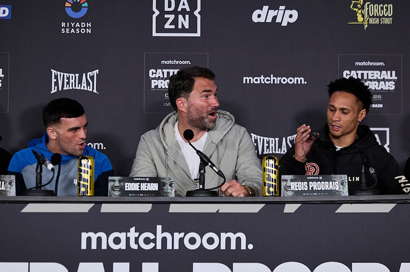 Regis Prograis plays a message from Jack Catterall's manager Sam Jones as promoter Eddie Hearn reacts. Photo: Mark Robinson, Matchroom Boxing