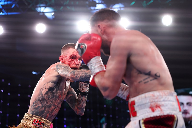 Gary Cully suffered a wicked cut on a punch by Maxi Hughes, but managed to see the final bell. Photo: Mark Robinson, Matchroom Boxing. 