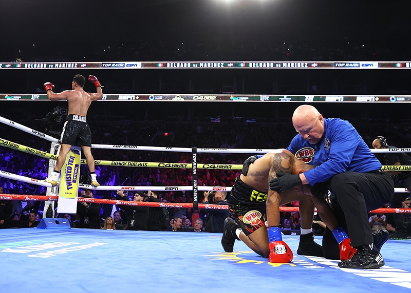 A body shot ended the fight in favor of Lindolfo Delgado in the fifth round. Photo: Mikey Williams, Top Rank