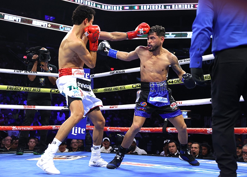 Rafael Espinoza was getting the better of Robeisy Ramirez in a close fight when Ramirez retired due to blurred vision in the sixth round. Photo: Mikey Williams, Top Rank