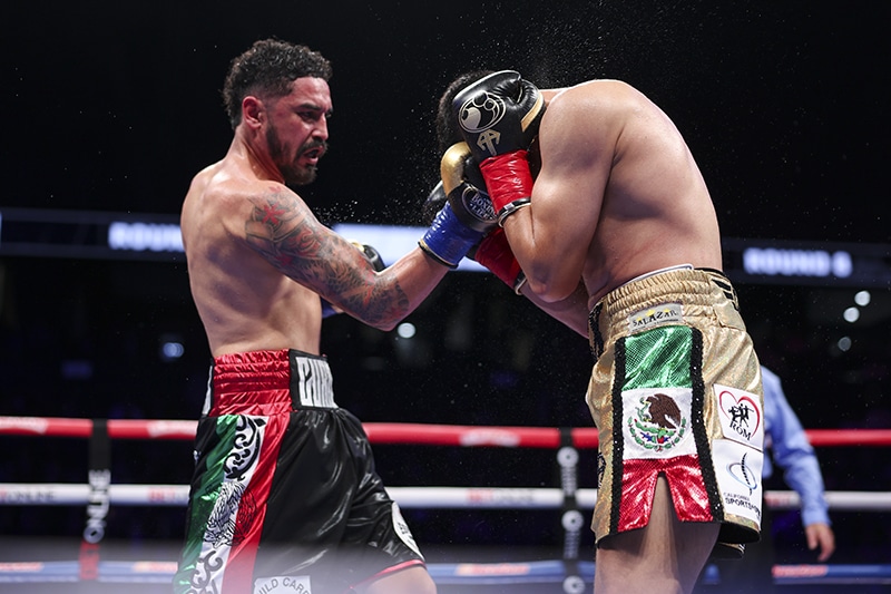 Raul Curiel's best punch is his right uppercut, and Alexis Rocha gave him the openings to land it. Photo: Cris Esqueda, Golden Boy Boxing