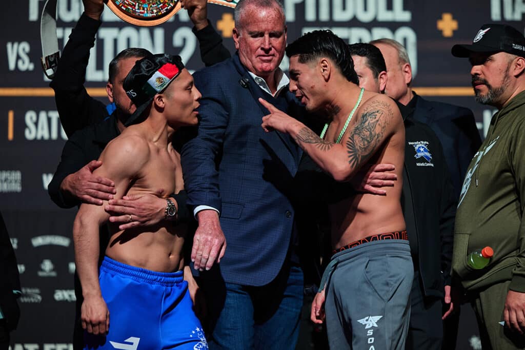 Isaac Cruz and Angel Fierro got fiesty with each other under the watch of TGB Promotions president Tom Brown. Photo: Esther Lin, Premier Boxing Champions