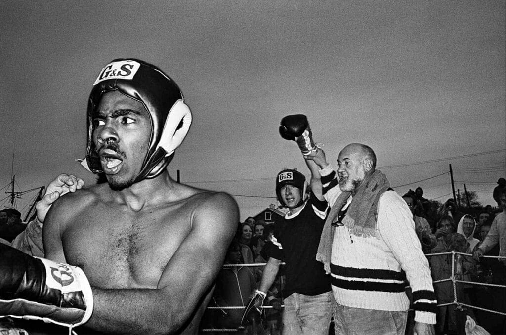 Robbery! U.S. Coast Guardsman loses to an unknown from Up Island as his hand is raised by ring announcer Rick Reilly. Photo: Tom Watson