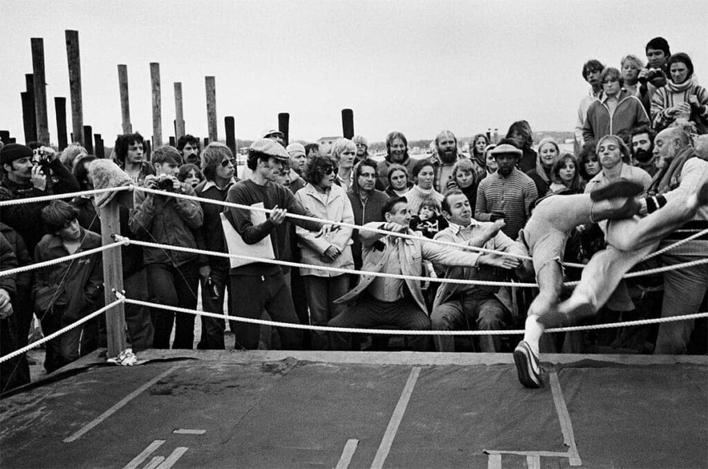 Steve Houseknecht and Mike Ushko fly through the ropes as fight judge Pat Sweeney looks on (center). Photo: Tom Watson