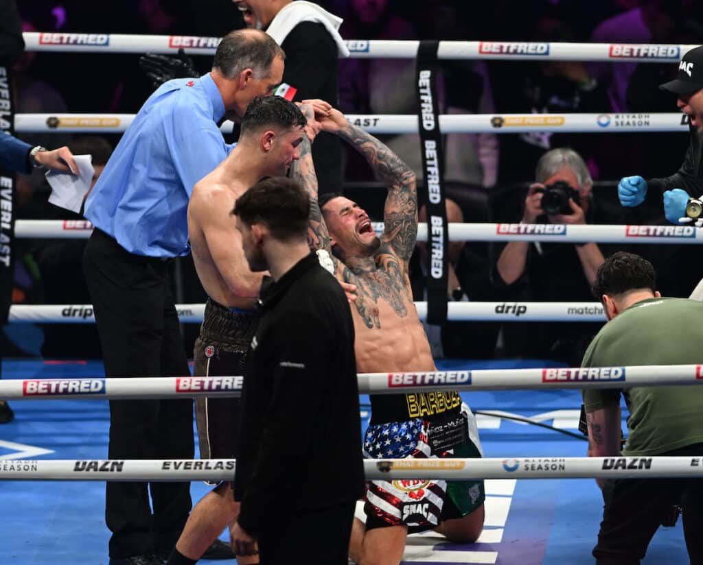 Arnold Barboza Jr, dropped to his knees as he heard the two 115-113 scores in his favor. Photo: Matthew Pover, Matchroom Boxing