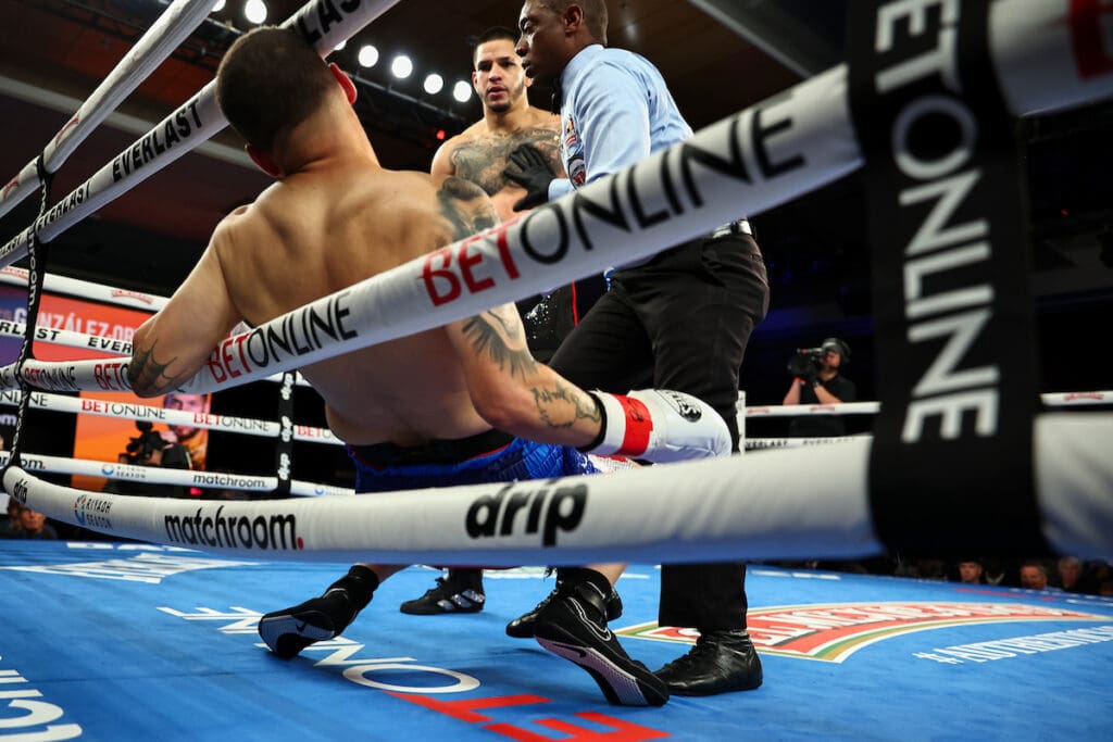 Referee Charles Young steps in after the third knockdown by Edgar Berlanga of Jonathan Gonzalez-Ortiz to end the fight. Photo: Melina Pizano, Matchroom Austin Williams Omari Jones