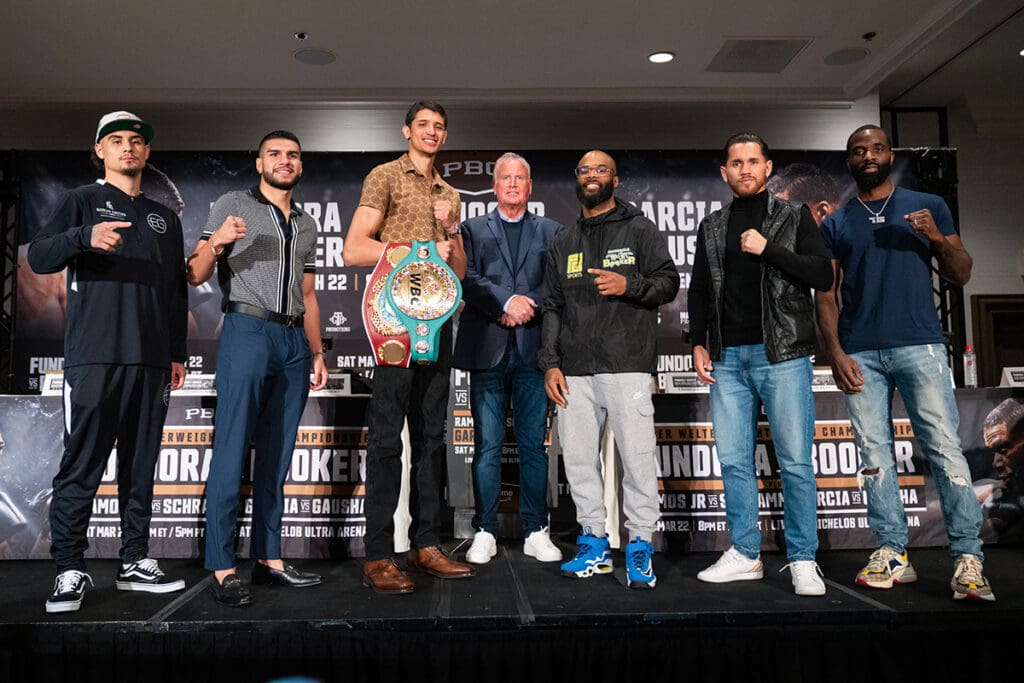 (L to R): Saturday's lineup includes Elijah Garcia, Jesus Ramos Jr., Sebastian Fundora, Chordale Booker, Guido Schramm, and Terrell Gausha, posing with promoter Tom Brown. Photo: Ryan Hafey, Premier Boxing Champions