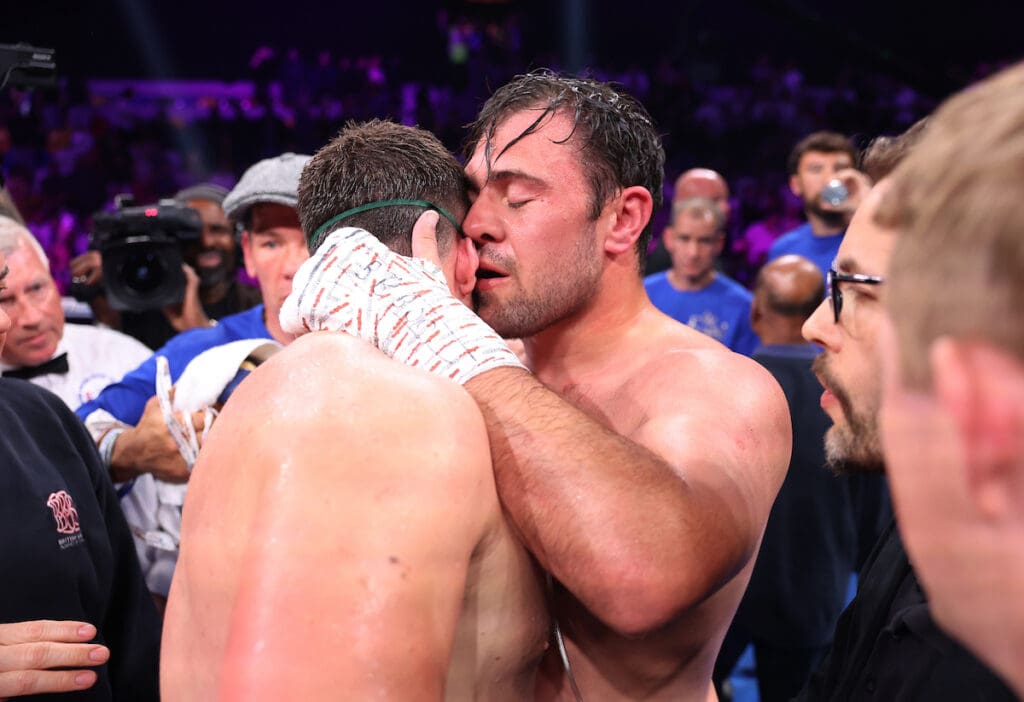 Dave Allen consoles his opponent and friend, Johnny Fisher, after knocking him out to win the WBA Intercontinental Heavyweight title. Photo: Mark Robinson, Matchroom Boxing.