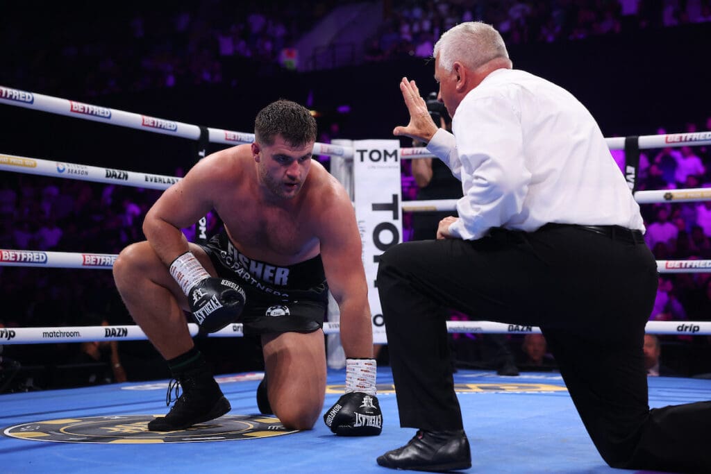 After the first knockdown, Johnny Fisher beat the count and it seemed like he would make it to the corner at the end of the round just seconds away. Photo: Mark Robinson, Matchroom Boxing. 