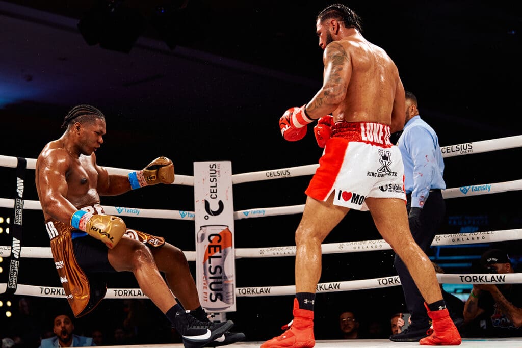 Dainier Pero hits the canvas after being nailed with a right hook by Cesar Navarro. Photo: Harry Aaron, Most Valuable Promotions
