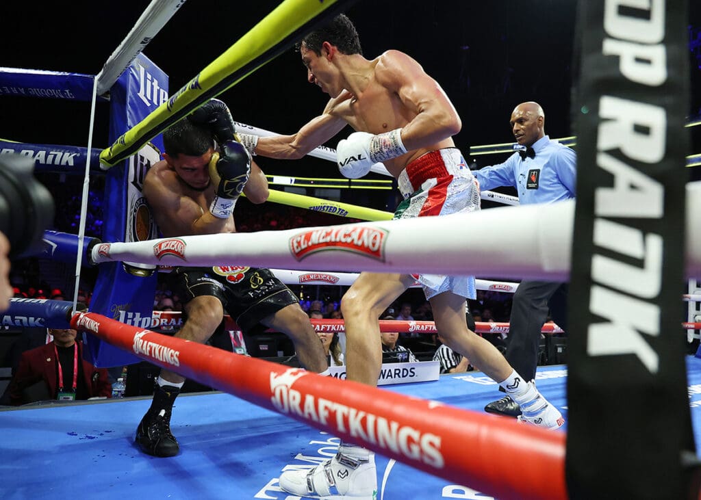 With Harvey Dock watching nearby, Rafael Espinoza forced him to step in at the end of round seven. Photo: Mikey Williams, Top Rank Boxing