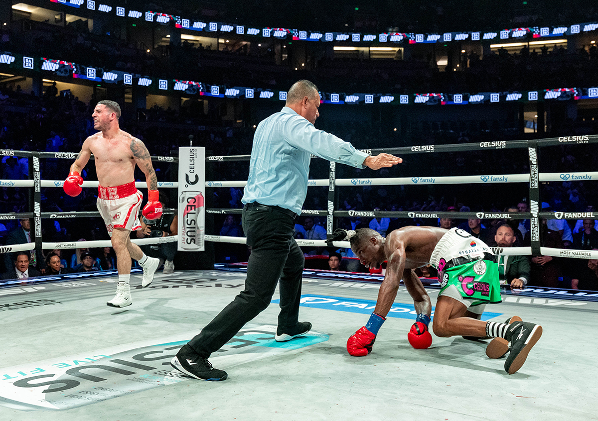 Julian Rodriguez watches as referee David Solivan waves off the fight with a knockout over Avious Griffin. Photo: Esther Lin, Most Valuable Promotions