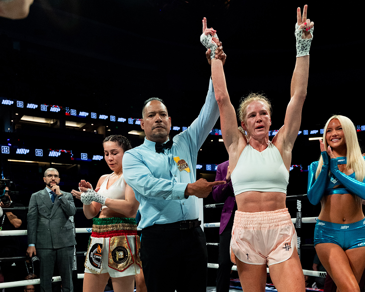 Holly Holm gets her hands raised in victory after her long absence from the boxing ring. Photo: Esther Lin, Most Valuable Promotions