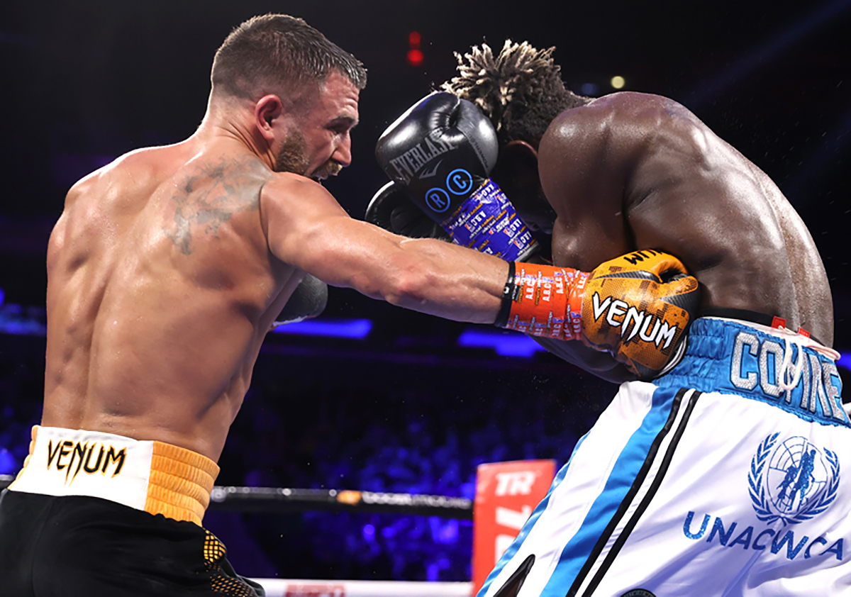 Vasiliy Lomachenko digs to the body of Richard Commey during their fight for the WBO intercontinental lightweight championship at Madison Square Garden on December 11, 2021. Photo: Mikey Williams, Top Rank Inc via Getty Images