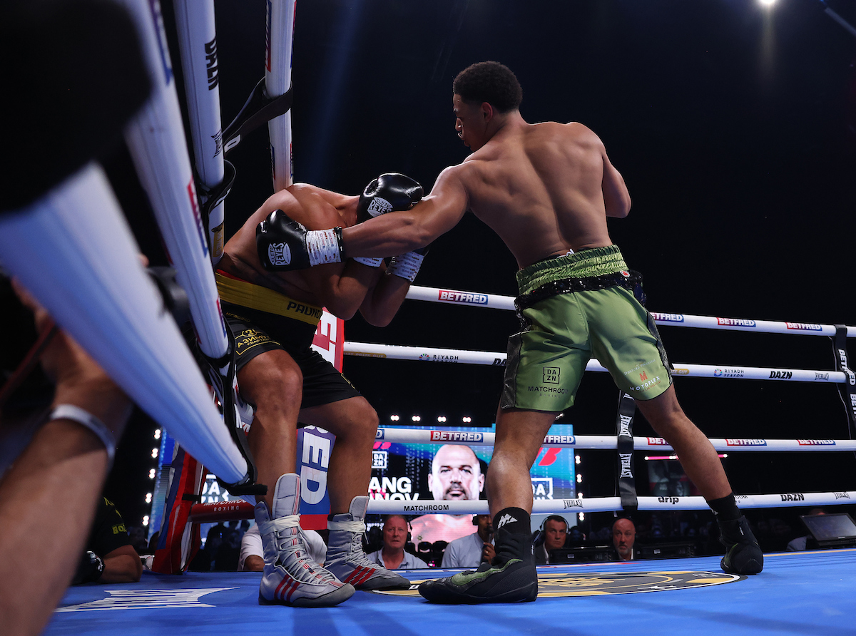 Leo Atang delivers the left hook to the liver of Milen Paunov. Photo: Mark Robinson, Matchroom Boxing