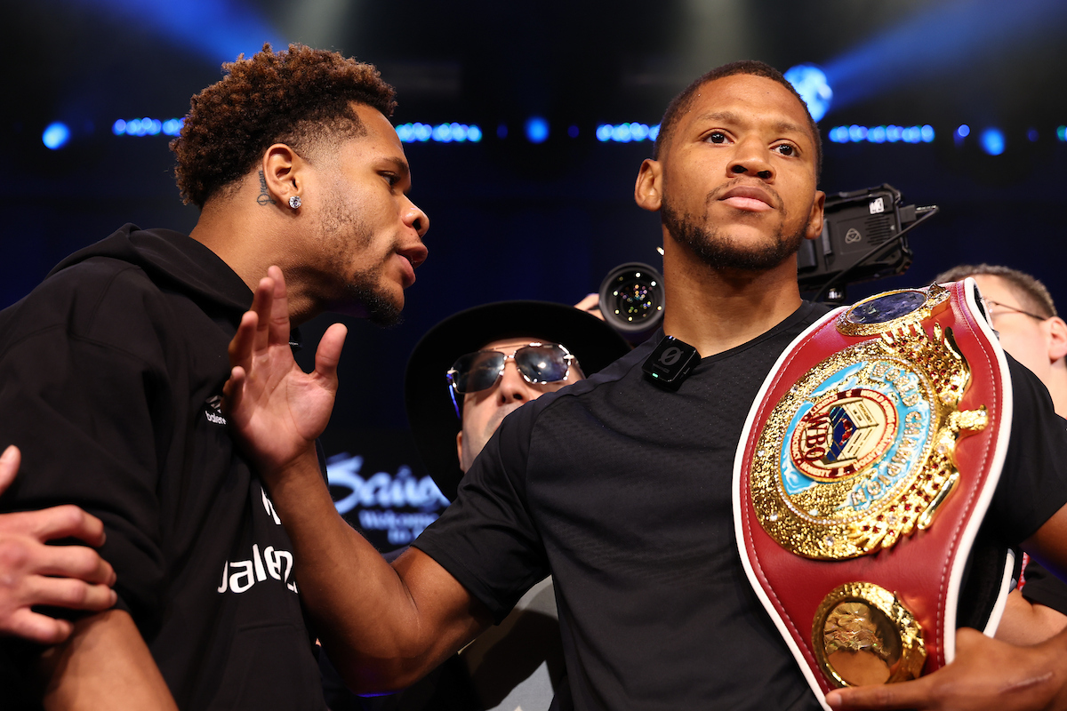 Devin Haney gets the brush off from Brian Norman Jr. at the Hard Rock Cafe on July 11 in New York City. Photo: Ed Mulholland/Queensberry Promotions Night of Champions