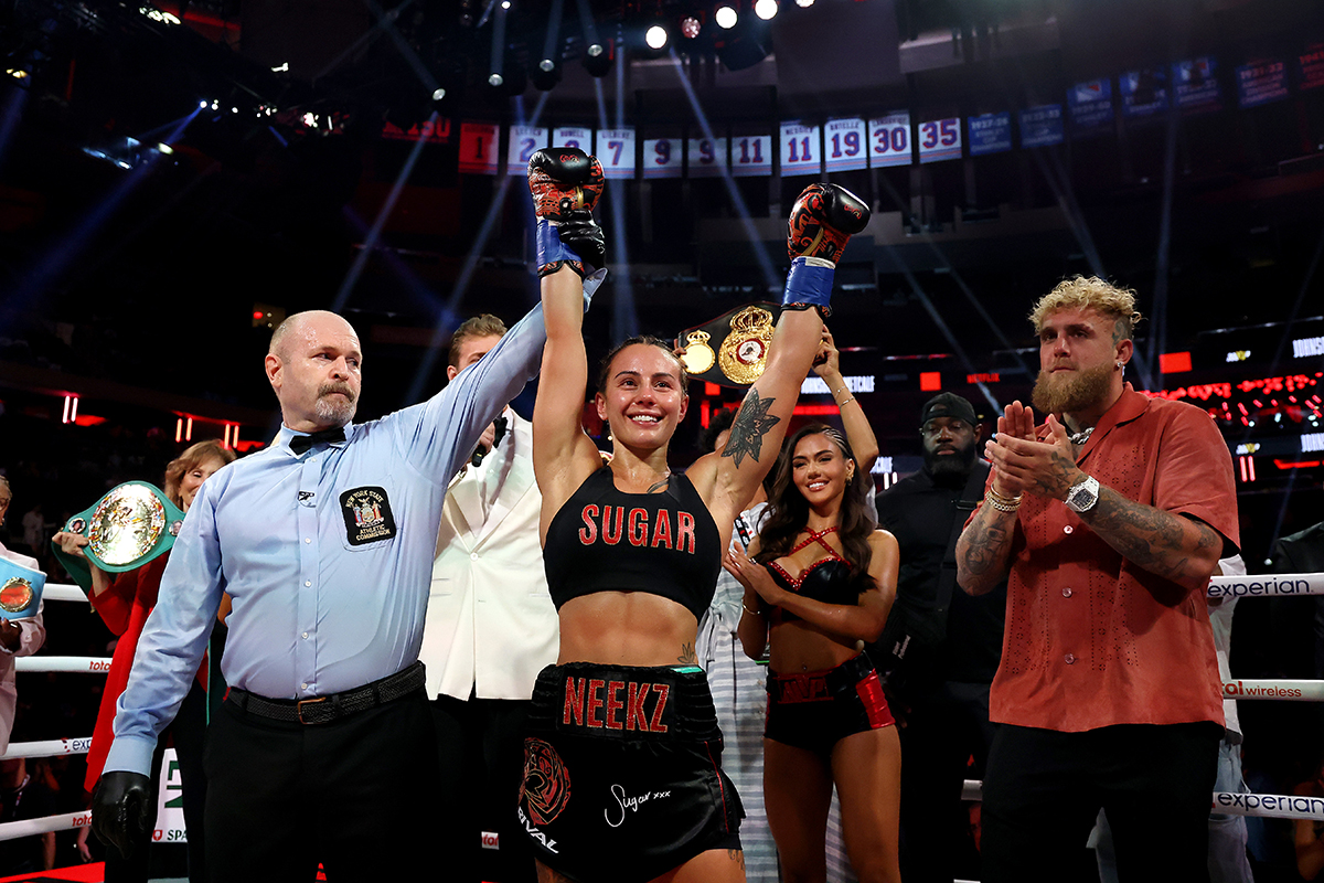 Cherneka Johnson celebrates defeating Shurretta Metcalf with promoter Jake Paul. Photo: Sarah Stier/Getty Images for Netflix