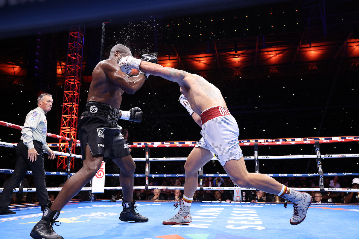 Oleksandr Usyk scored the first of two knockdowns, the second stopping Daniel Dubois in round five to win the undisputed heavyweight championship for a second time. Photo: Leigh Dawney/Queensberry