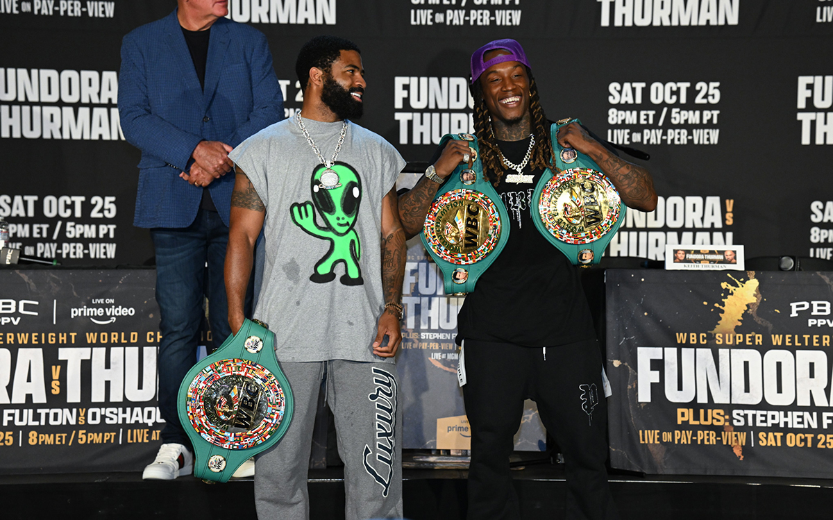 Stephen Fulton and O'Shaquie Foster were all smiles on stage posing with their belts, but they had words on stage earlier. Photo: Lina Baker, Premier Boxing Champions Fundora vs Thurman