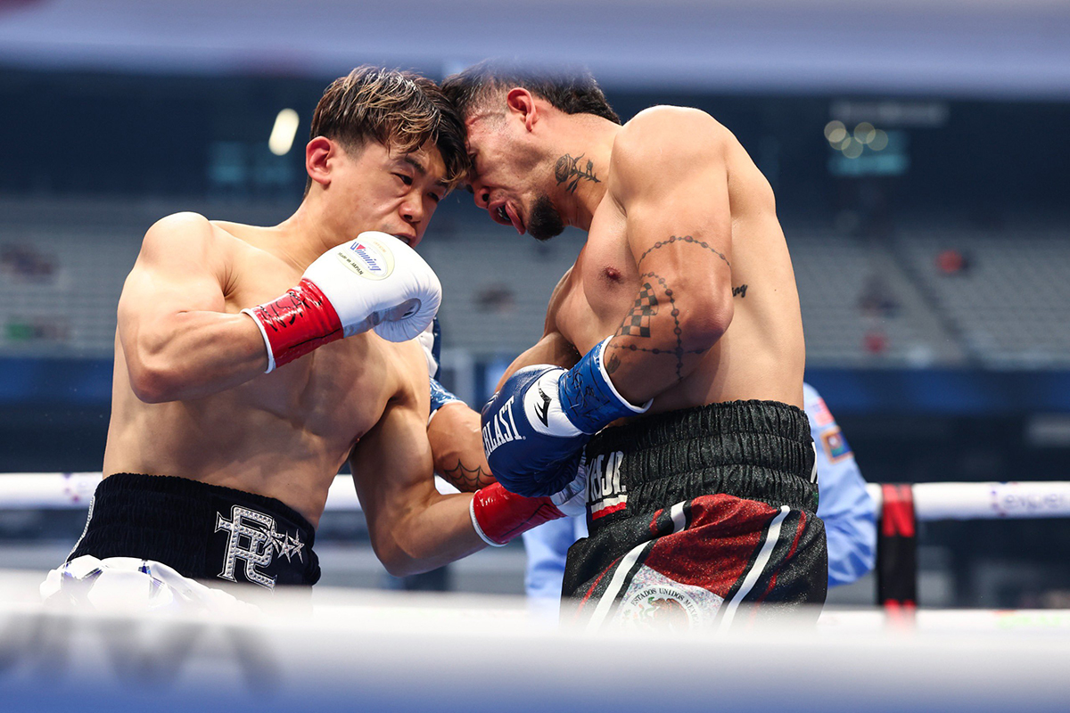 Reiko Tsutsumi rips to the body of Javier Martinez, and he didn't last the opening round. Photo: Zuffa Boxing Bohachuk
