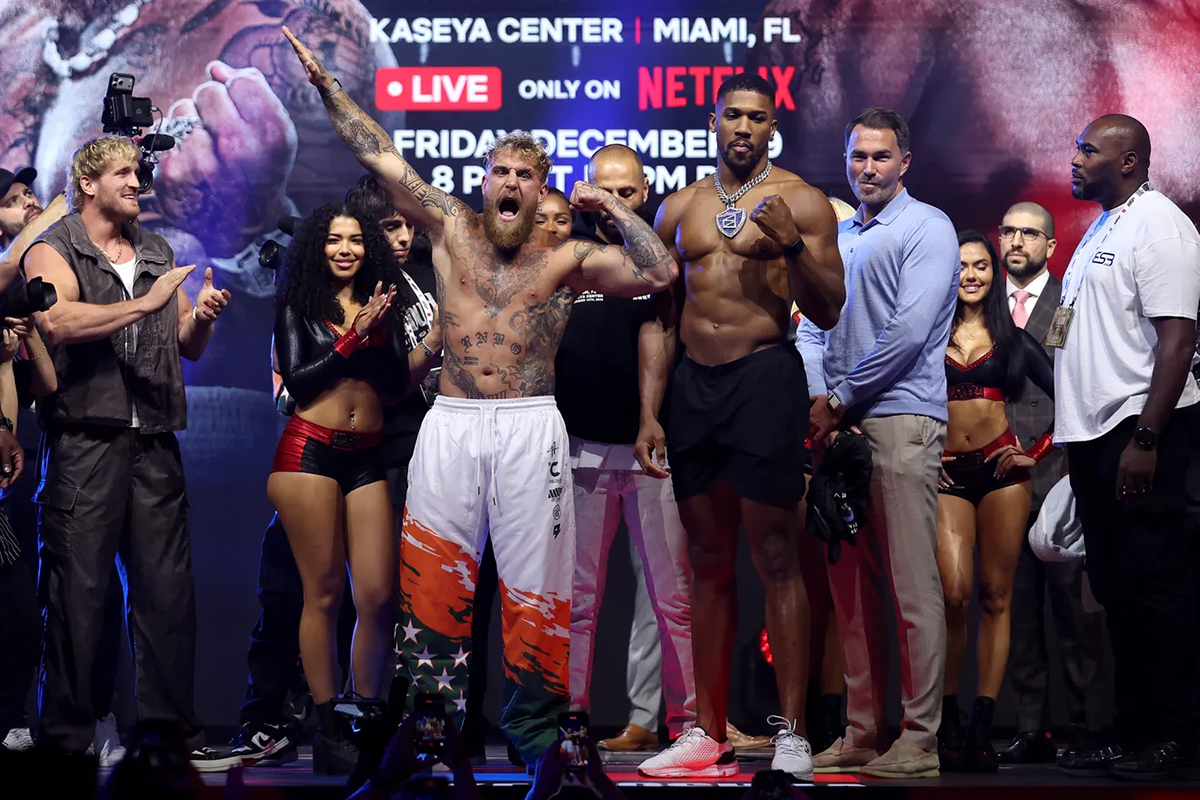 Jake Paul and Anthony Joshua pose after their weigh-in Thursday in Miami for Friday's eight-round "Judgement Day" showdown on Netflix. Photo: Megan Briggs, Getty Images For Netflix Jake vs Joshua