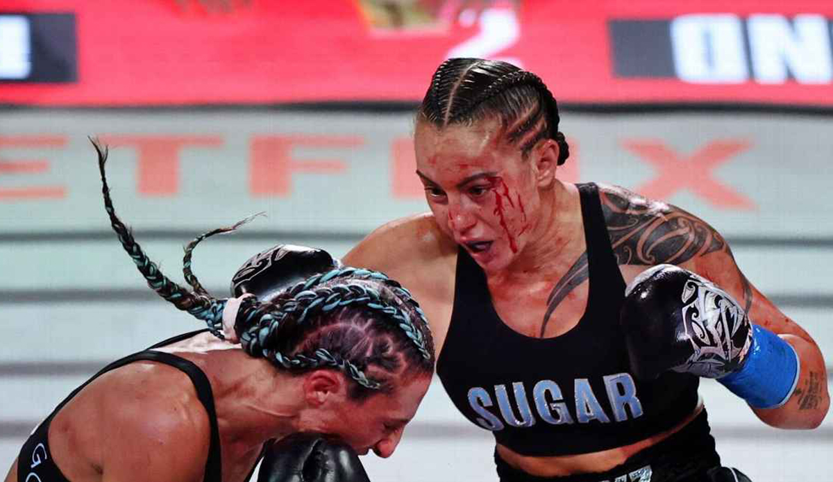Cherneka Johnson fought her way through a bloody fight to defend her titles on the undercard. Photo: Carmen Mandato/Getty Images for Netflix