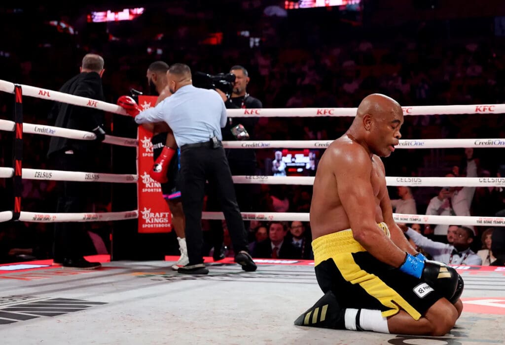 Anderson Silva drops to his knees, celebrating his knockout victory over Tyron Woodley Saturday on the Jake vs Joshua undercard. Photo: Ed Mulhollland/Getty Images for Netflix