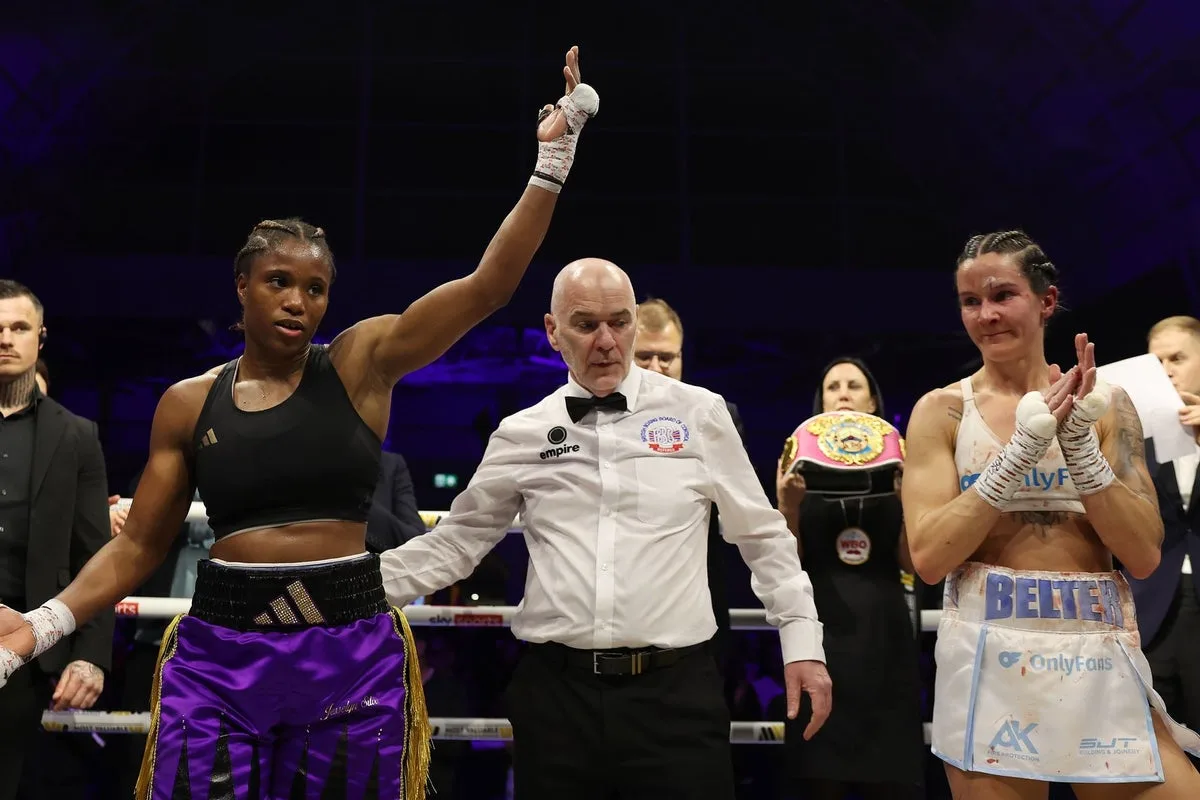 Caroline Dubois acknowledges the fans as she wins the unified lightweight fight over Terri Harper on Sunday. Photo: Mark Robinson, Most Valuable Promotions MVPW01