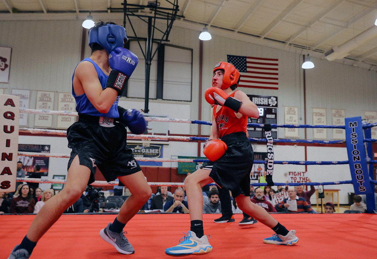 Charlie Doell-Lewis in red (Class of 2026) up against Dom Marcello in blue (Class of 2029. Photo: Aquinas Institute