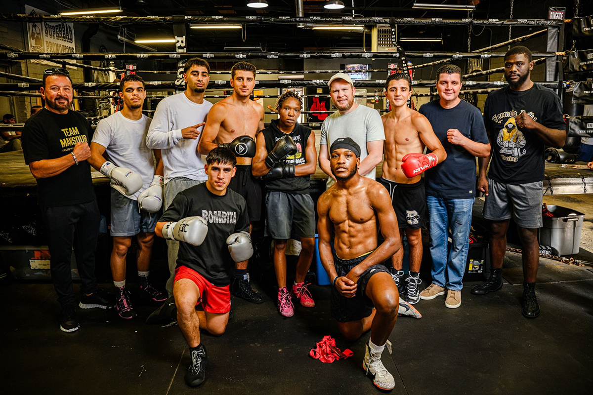 Participants on Saturday's card gathered for a media workout event at the Superbad Gym owned by former world champion Tony Harrison (front row at right). Photo: Andrew Potter, Salita Promotions