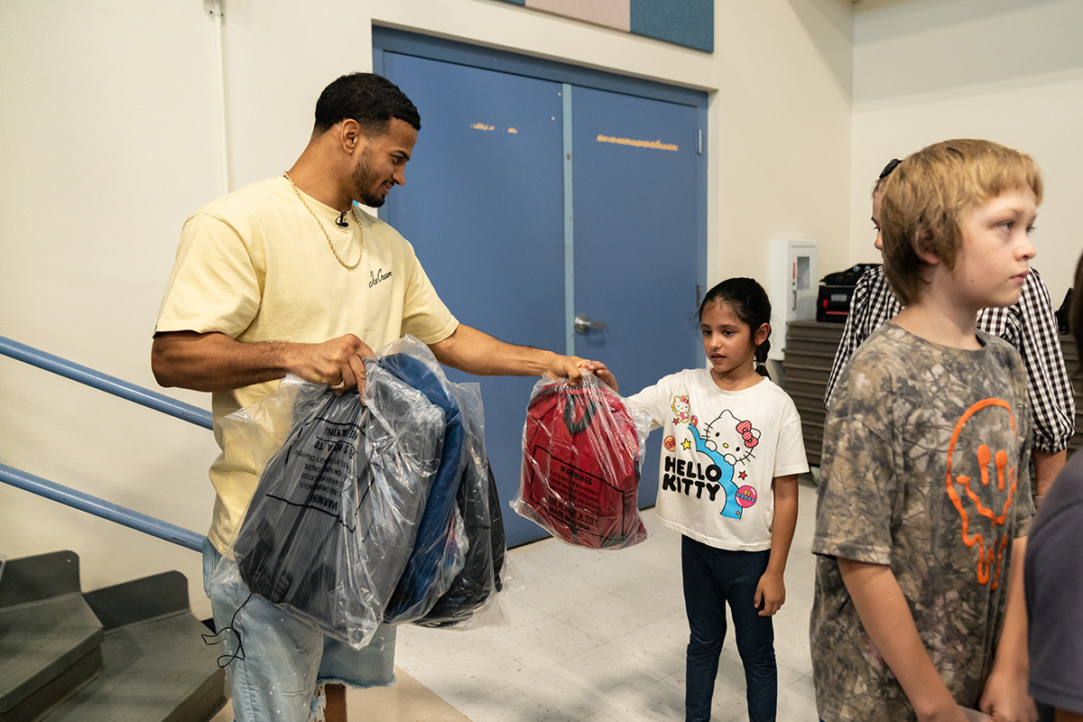 Rolly Romero handed out backpacks to students, gave autographs and posed for many photos with students. Photo: Ryan Hafey, Premier Boxing Champions