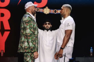 Tyson Fury and Anthony Joshua have their first faceoff Wednesday in London, with Turki Alalshihk holding the RING Magazine belt. Photo: Zacharias Delgado, Matchroom Boxing