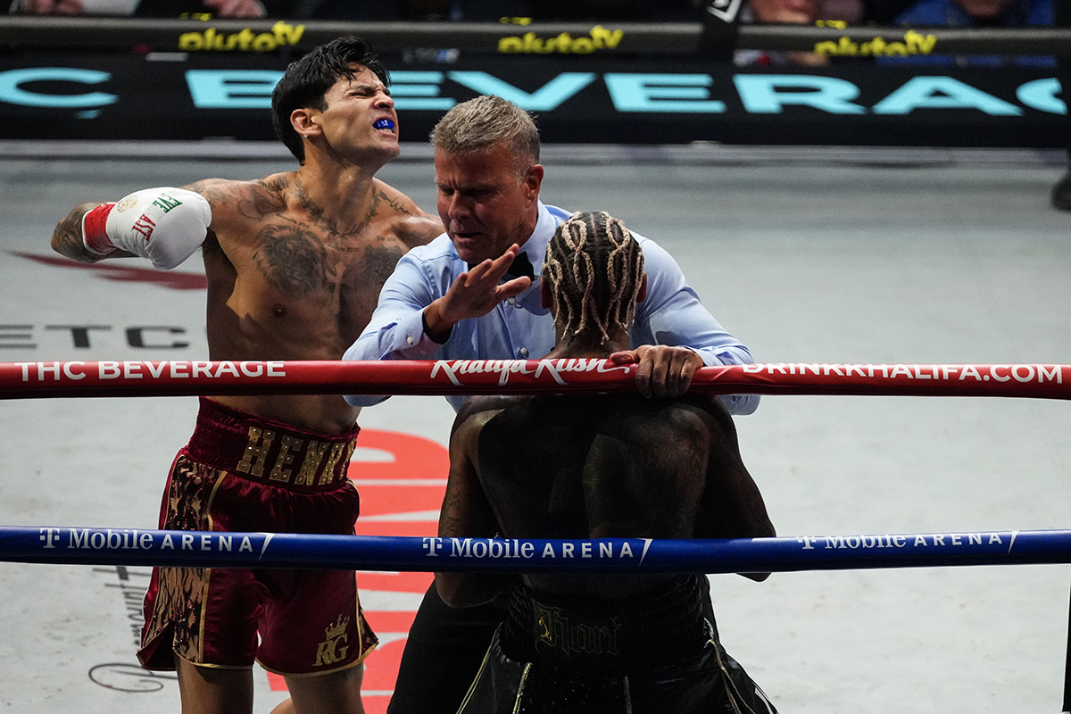 Referee Thomas Taylor moves in to stop the fight. Photo: Al Powers/Zuffa Boxing via Getty Images