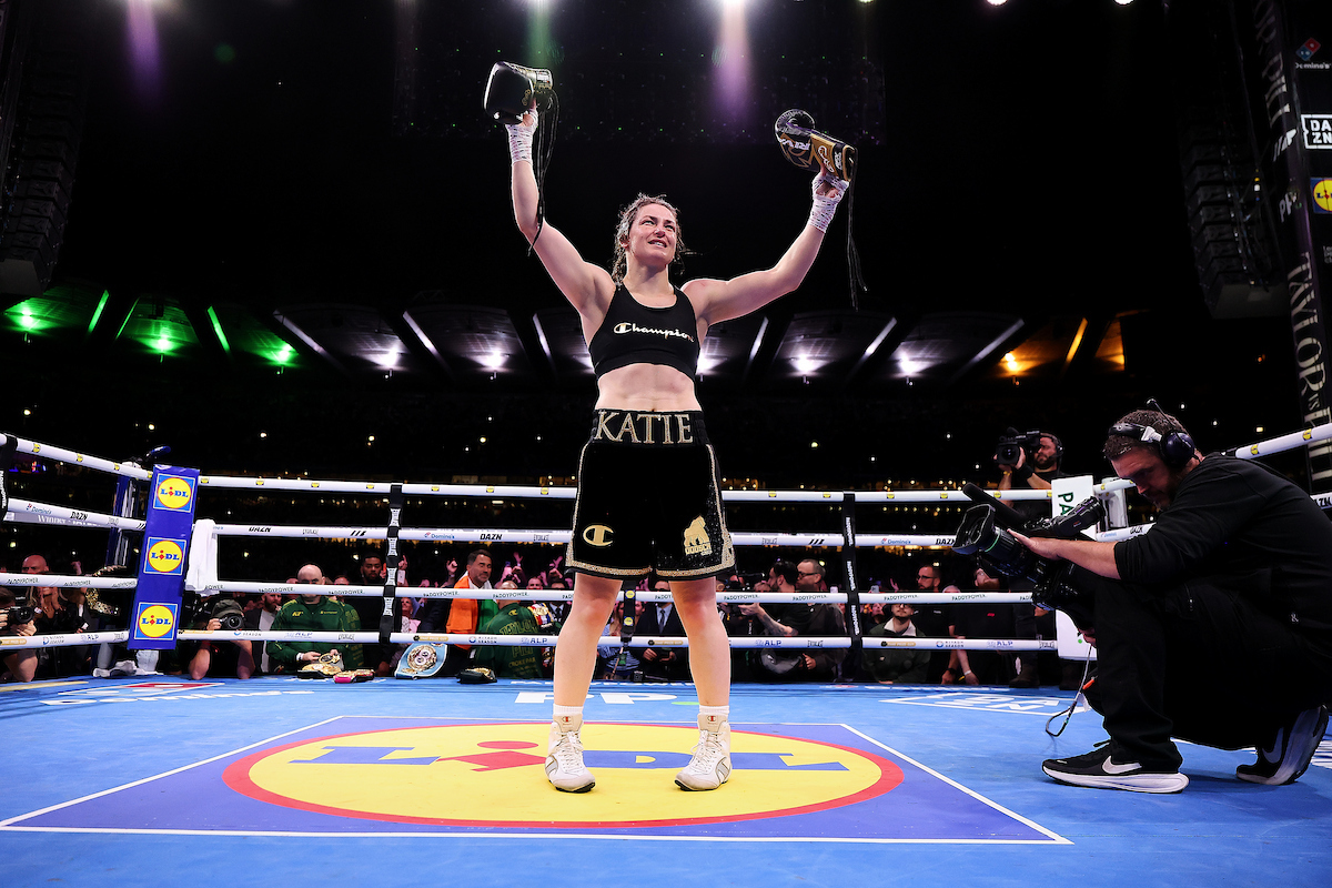 At the end of her final fight, Katie Taylor placed her gloves in the centre of the ring, a symbol of retirement. Her belts were later added. Photo: Mark Robinson, Matchroom Boxing