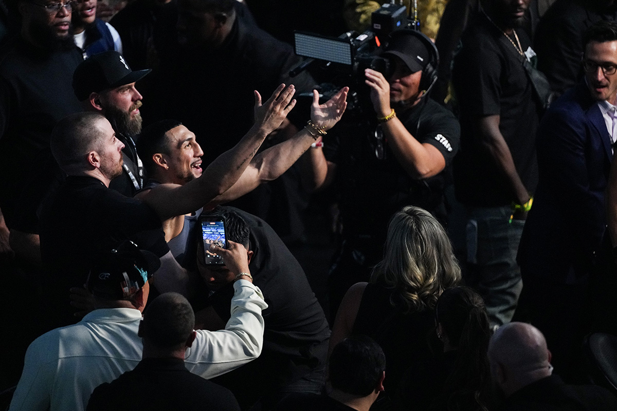 Teofimo Lopez is stopped by security and prevented from coming into the ring after Ryan Garcia defeated Conor Benn. Photo: Al Powers/Zuffa Boxing via Getty Images