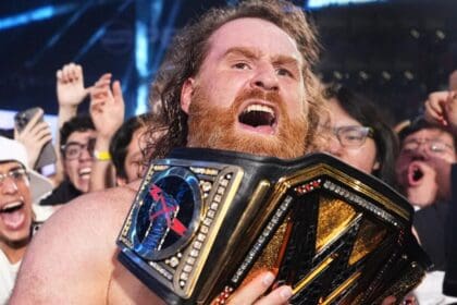 Sami Zayn with the WWE Championship belt