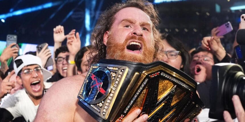 Sami Zayn with the WWE Championship belt