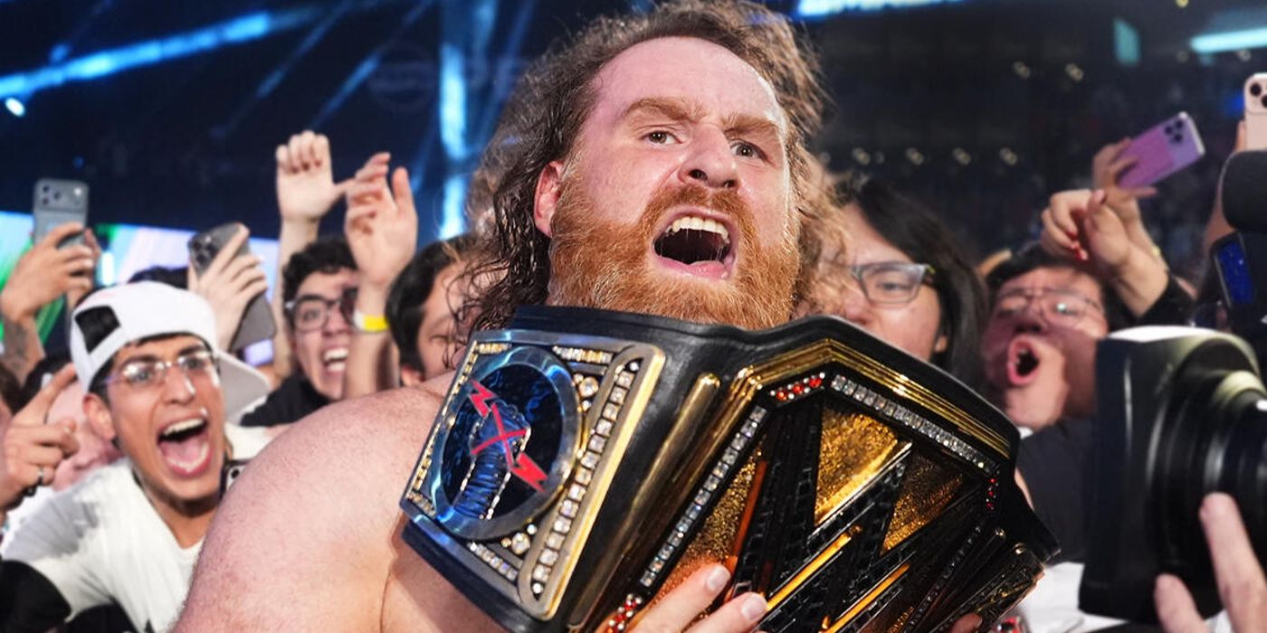 Sami Zayn with the WWE Championship belt
