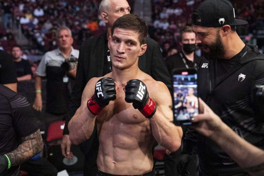 June 12, 2021, Glendale, Arizona, USA: GLENDALE, Ariz. - June 12, 2021: for SPORTS. UFC No. 14 Featherweight Movsar Evloev of Russia (Red gloves) defeats UFC No. 15 Featherweight Hakeem Dawodu of Canada (Blue gloves) by Unanimous Decision at UFC 263 in the Gila River Arena. Glendale USA - ZUMAb177 20210612_zap_b177_590 Copyright: xTaidghxBarronx